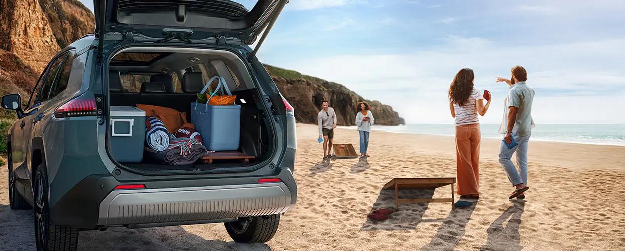 family at the beach with their Toyota SUV