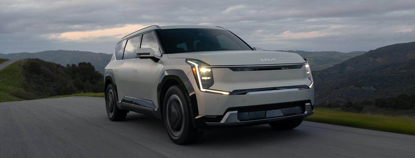 Gray 2024 Kia EV9 driving on the road