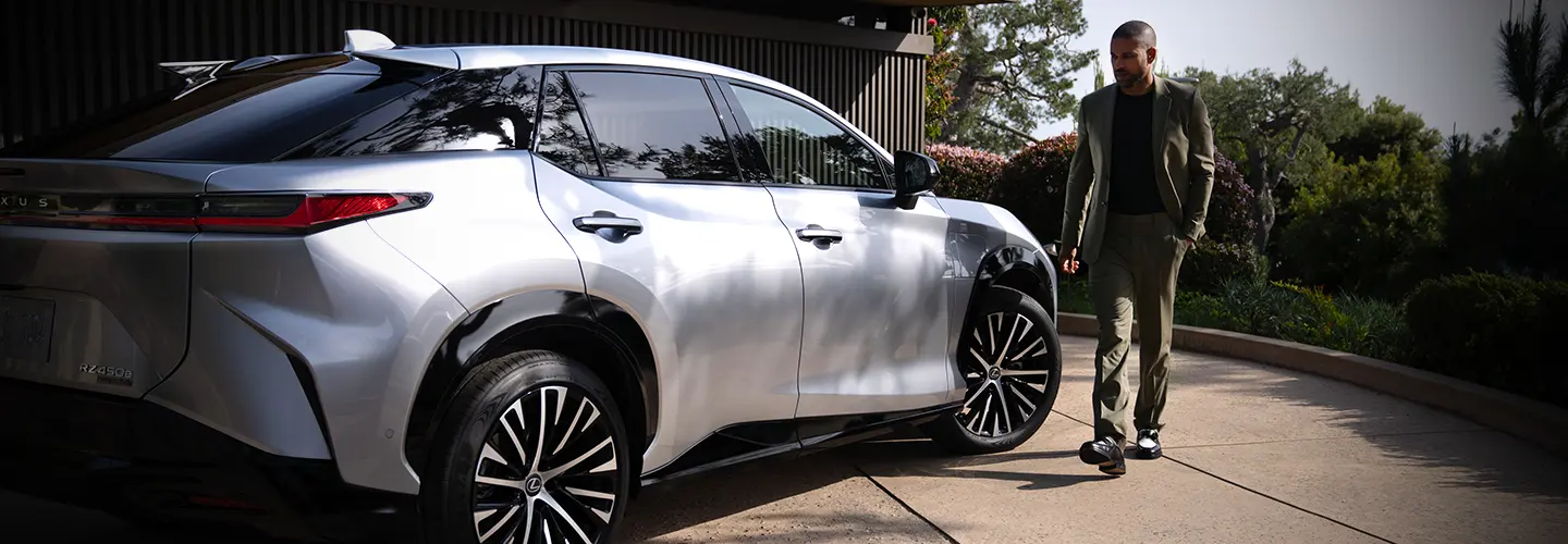 a person looking over details of a Lexus puchase with salesperson