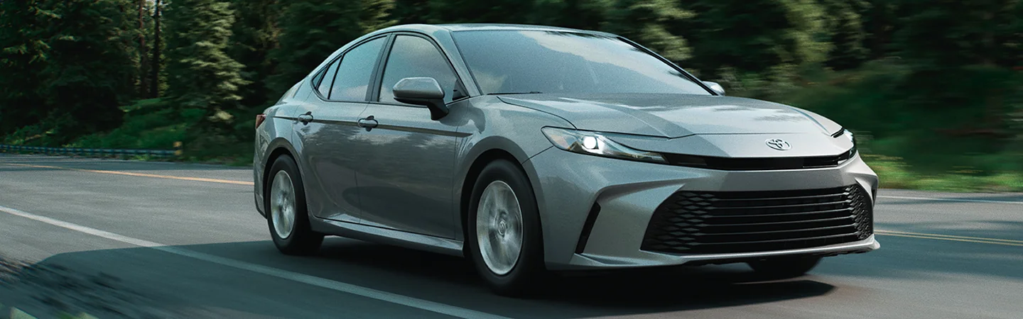2025 Toyota Camry driving downa a road