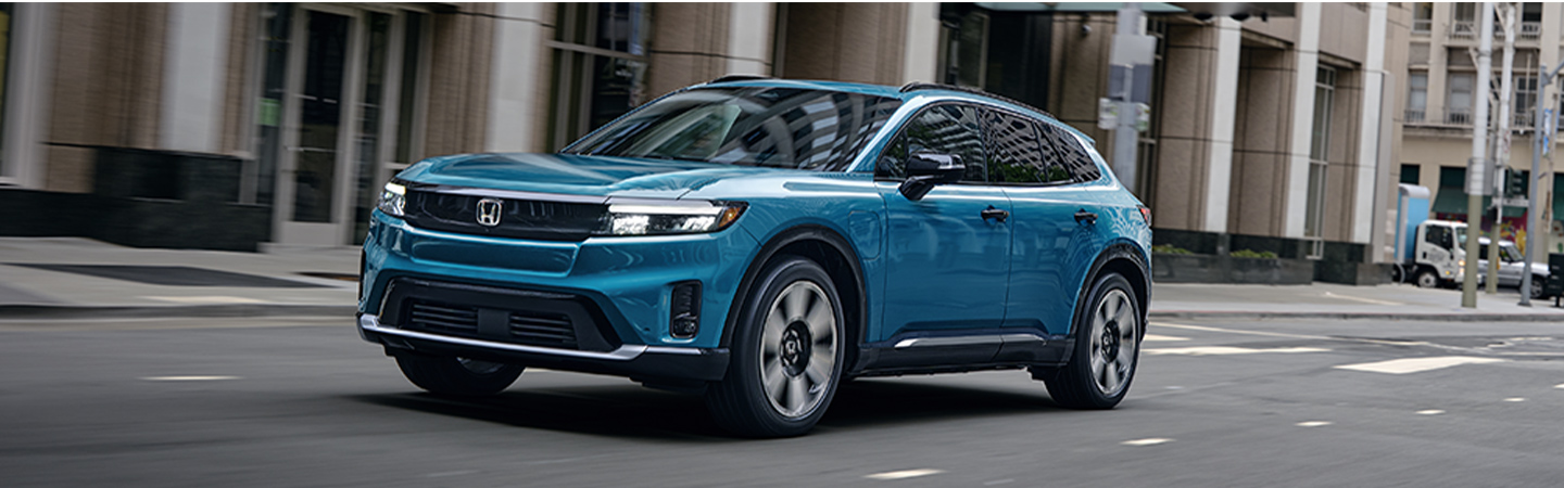 2024 Honda Prologue vs Toyota RAV4  side front in white colour 