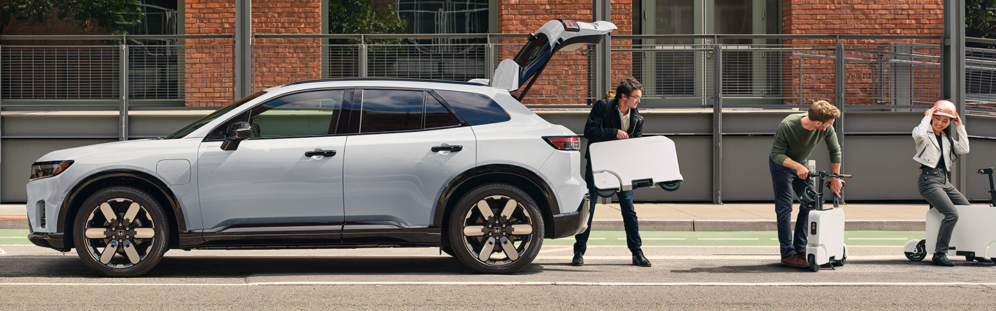 2024 Honda Prologue vs Toyota RAV4  side back in white colour 