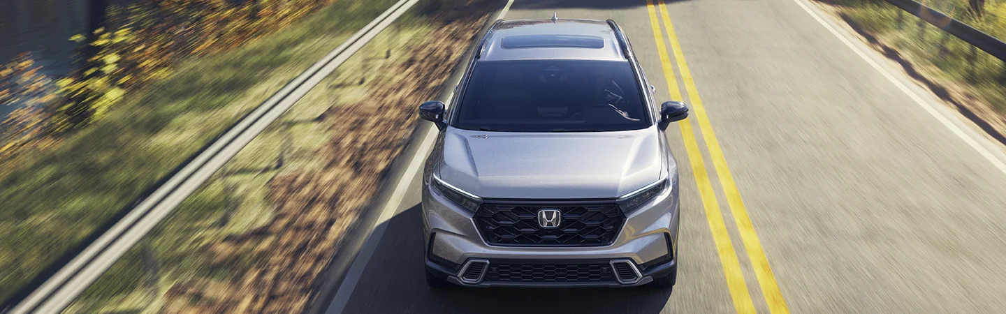 front right headlight closeup view of a 2025 Honda CR-V Hybrid Sport
