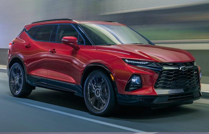 Angled side profile of a red Chevy Blazer