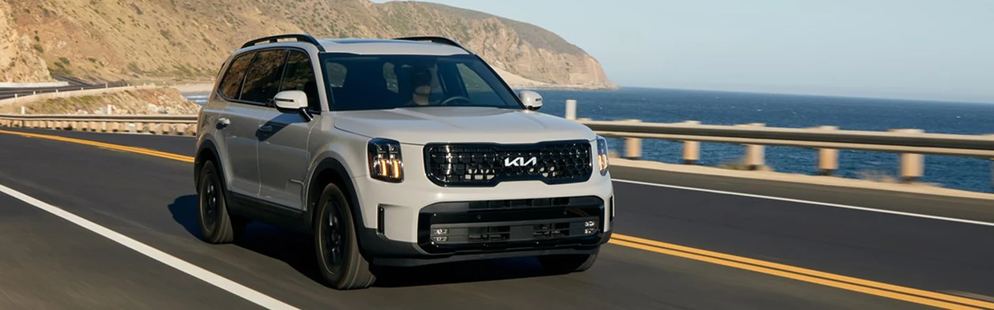 2025 Kia Telluride SX-Prestige X-Pro in motion drivng on coastal highway