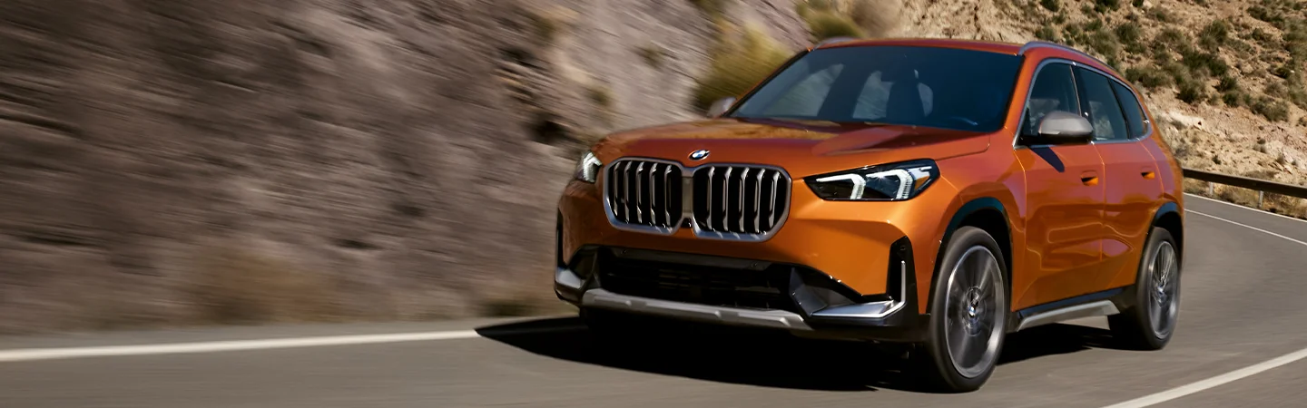 front view of orange 2025 BMW X1 M35i