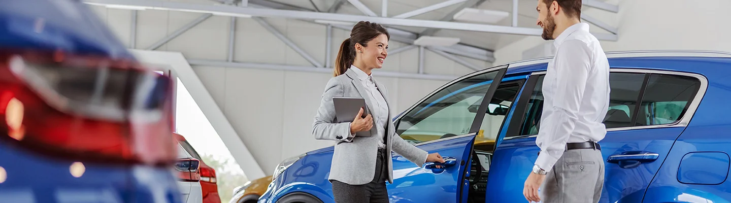 Service rep giving back car to a customer