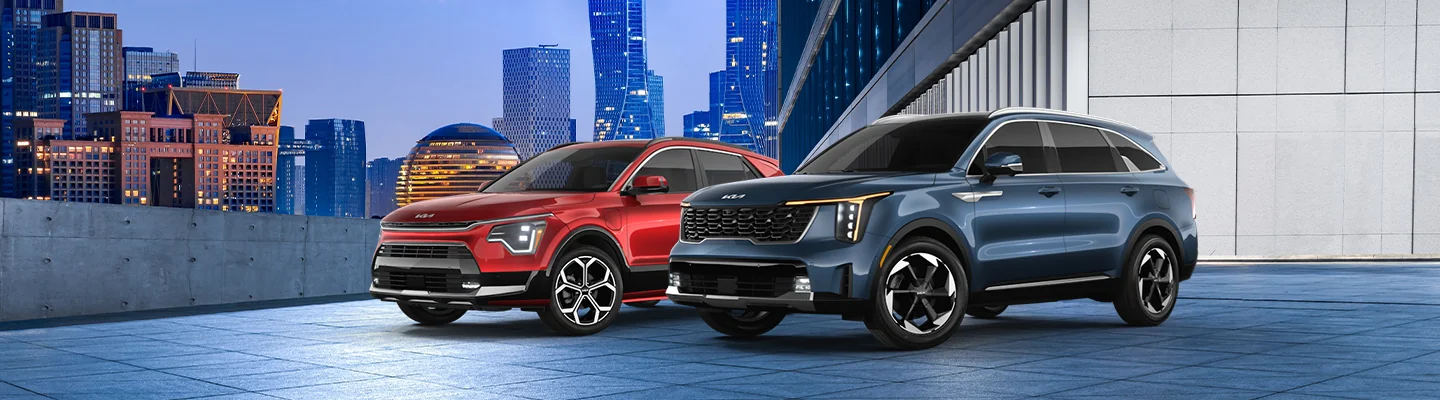 red and blue Kia Hybrid and Plug-In Hybrid Model images parked in modern city