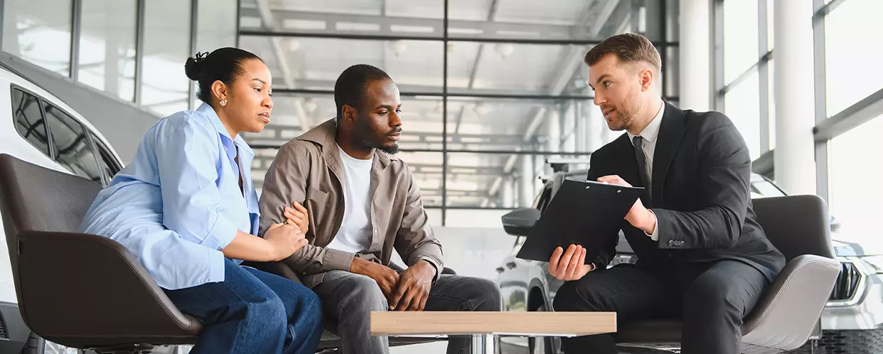 Customer reviewing Acura financing options with a Crown Acura advisor