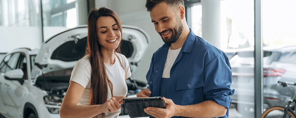 Service tech going over repairs with customer