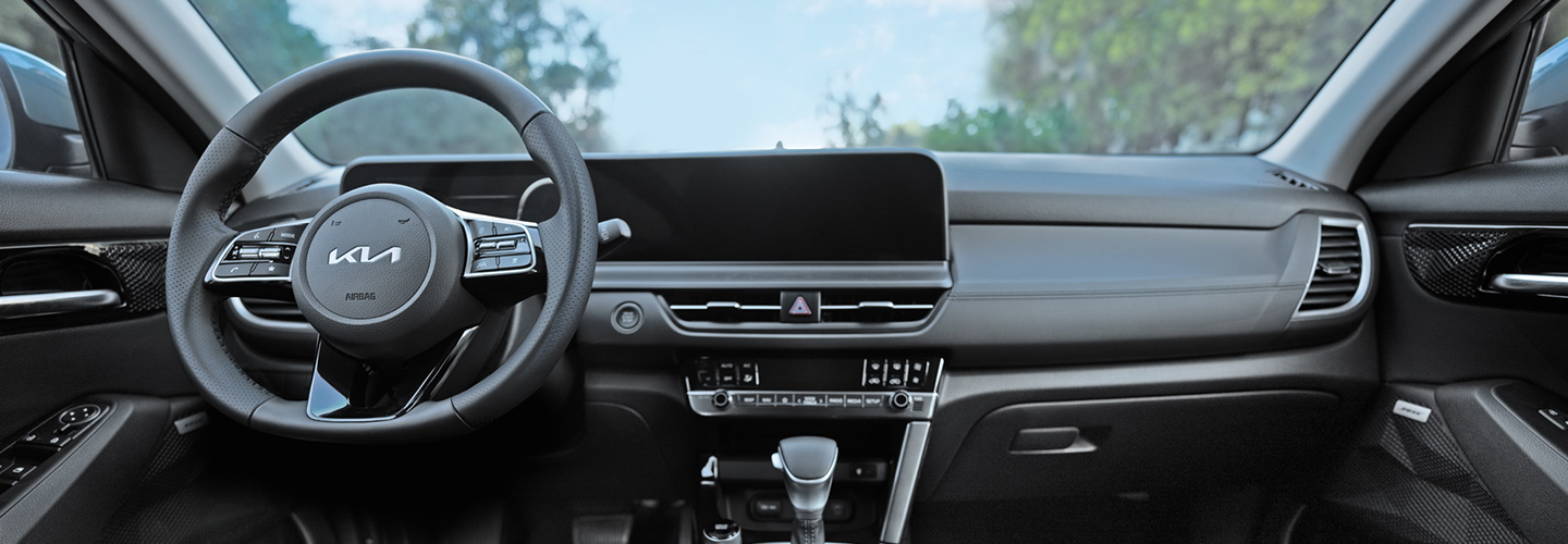 2024 Kia Seltos vs 2024 Toyota RAV4 black interior