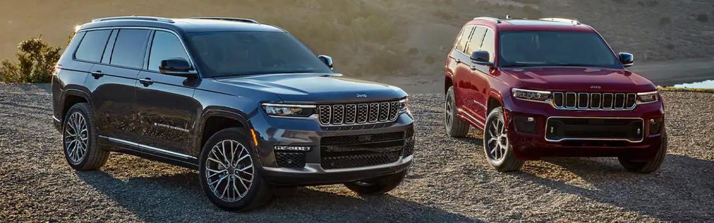  Black 2021 Jeep Cherokee side by side red 2021 Jeep Cherokee parked front view