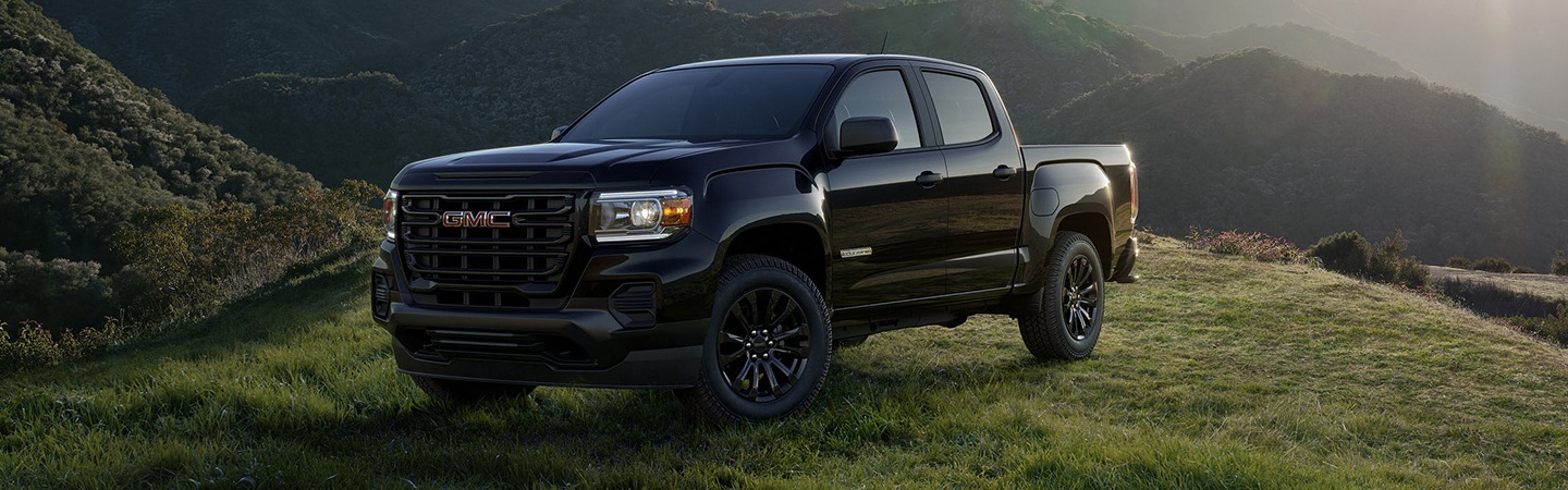 Black 2022 GMC Canyon parked in the wilderness