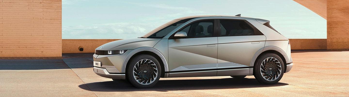 Side profile of a parked silver 2022 Hyundai IONIQ 5