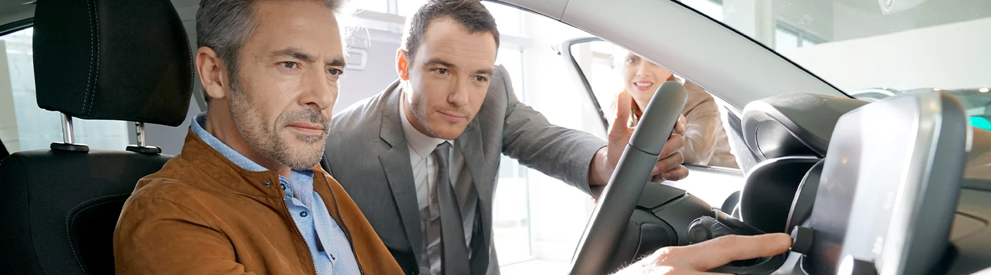 Sales person showing customers the inside of a new 2026 BMW X1