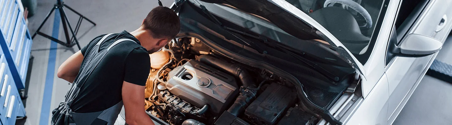 Honda service tech working on an engine