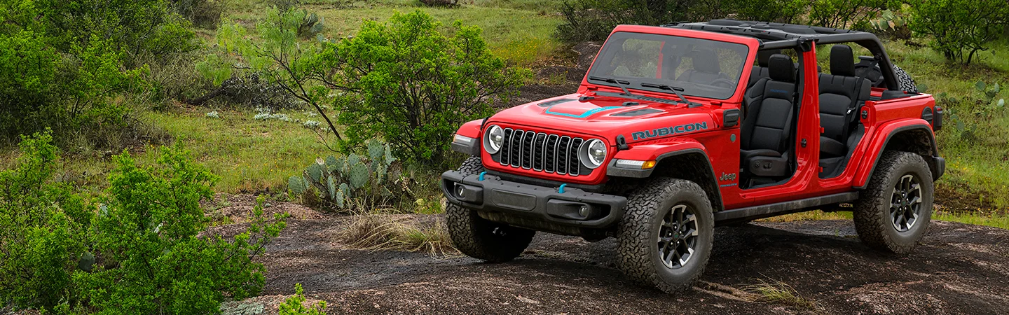 red Jeep vehicle on hills