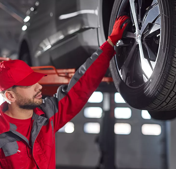 Technician doing servicing on a wheel