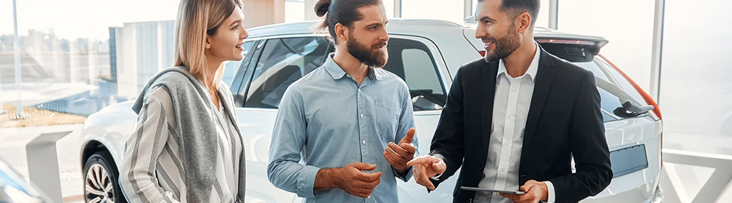 husband and wife talking to salesman