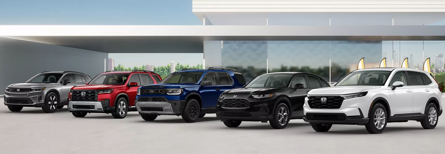 lineup of new Honda at our dealership showroom