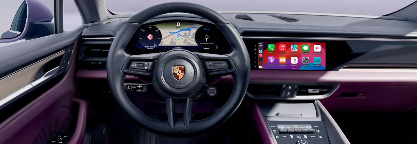Interior view of the dashboard and tech of a 2025 Porsche Macan