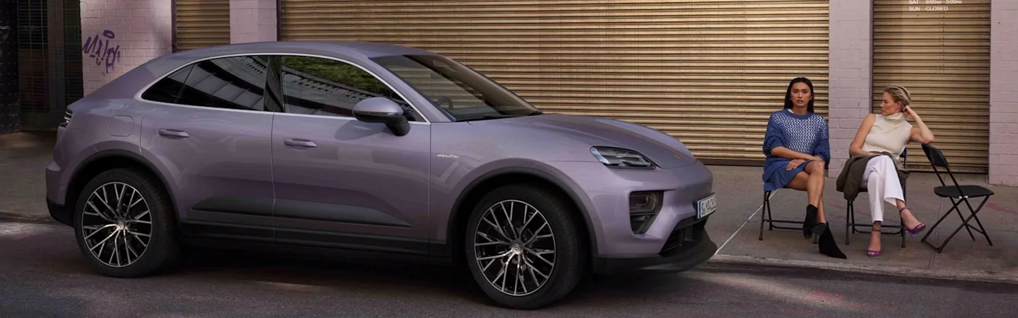 Purple 2025 Porsche Macan parked on a street