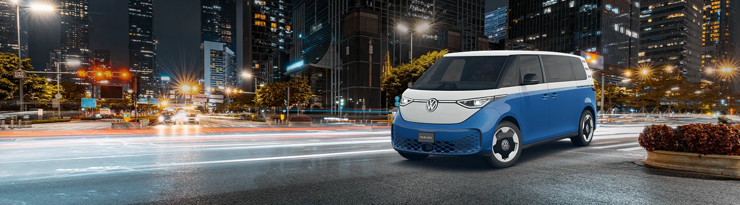 Volkswagen ID. Buzz parked in front of a city skyline