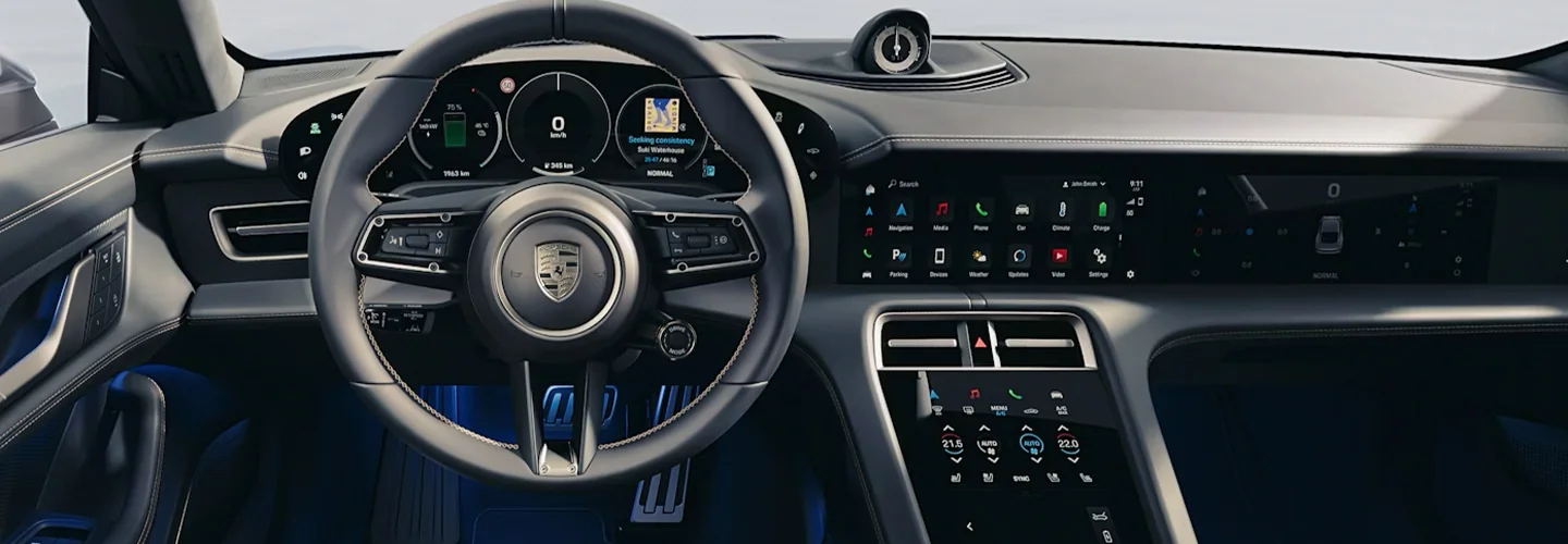 Interior view of the bashboard and tech of a 2025 Porsche Taycan
