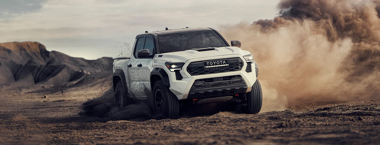 white Tacoma four wheeling