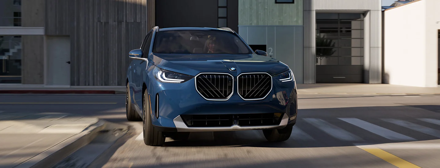new blue BMW X3 in driveway