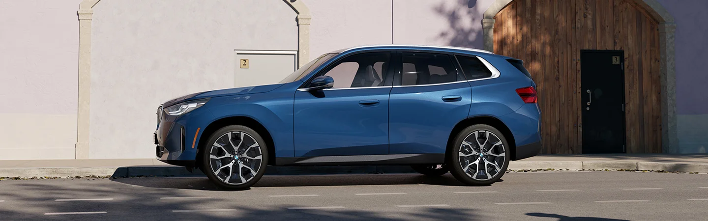 profile shot of blue new BMW X3 in Tallahassee FL