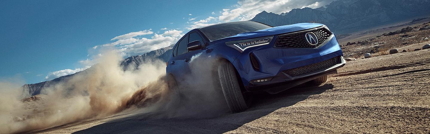 blue 2022 Acura RDX climbing hill