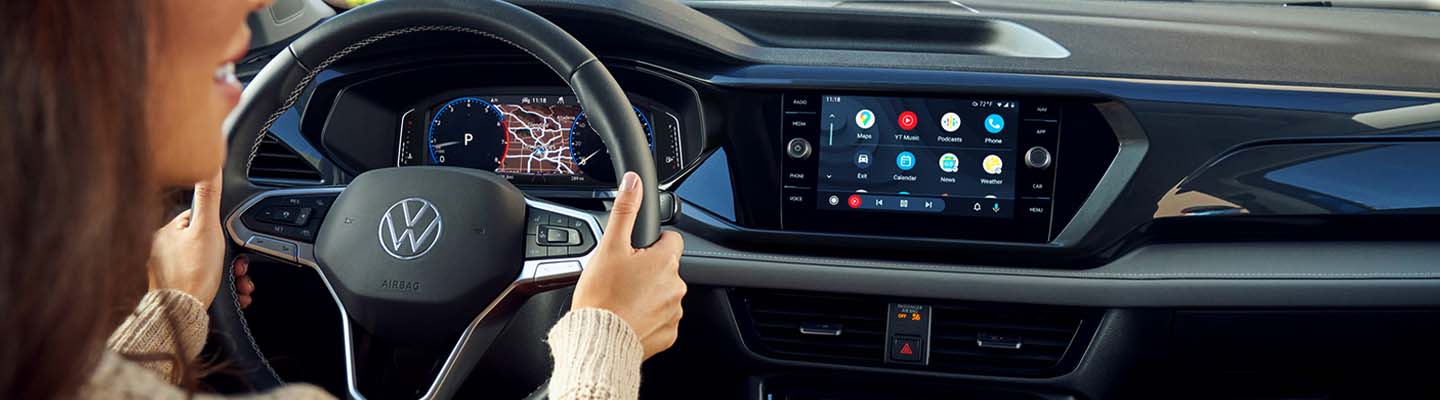 Close up view of a VW Taos steering wheel and dashboard