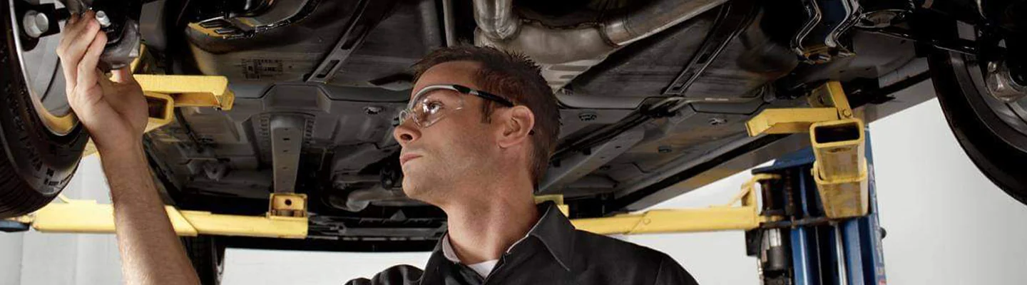Service technician working on a vehicle