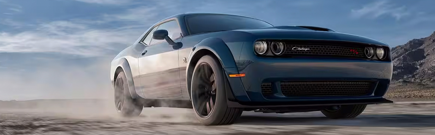 2024 Ford Mustang vs Dodge front side in blue colour Challenger