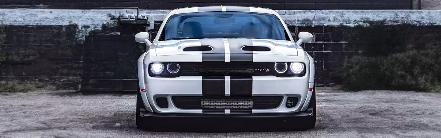 2024 Ford Mustang vs Dodge front side in white Challenger