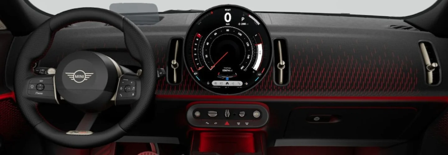 Interior view of the dashboard and tech of a 2025 JCW Countryman ALL4