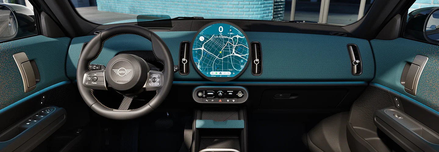 Interior view of the front seat and dashboard of a 2025 MINI Countryman SE ALL4