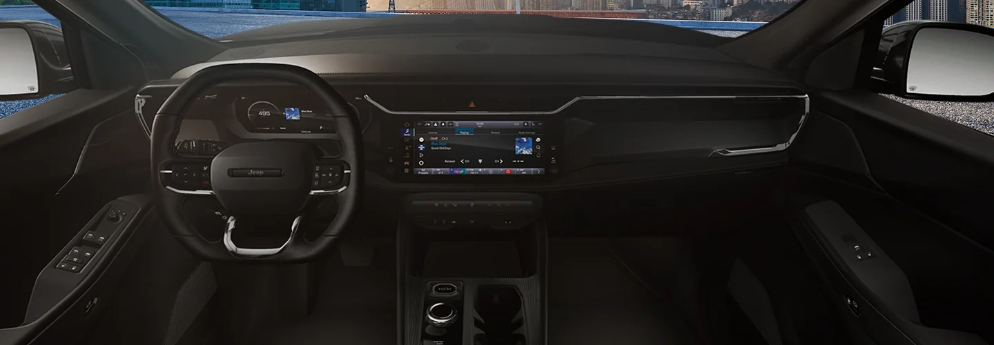 Interior view of a the dashboard and tech of a 2026 Jeep Cherokee
