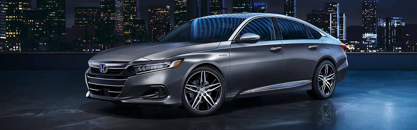 2021 Honda Accord sriver side view parked at night in city