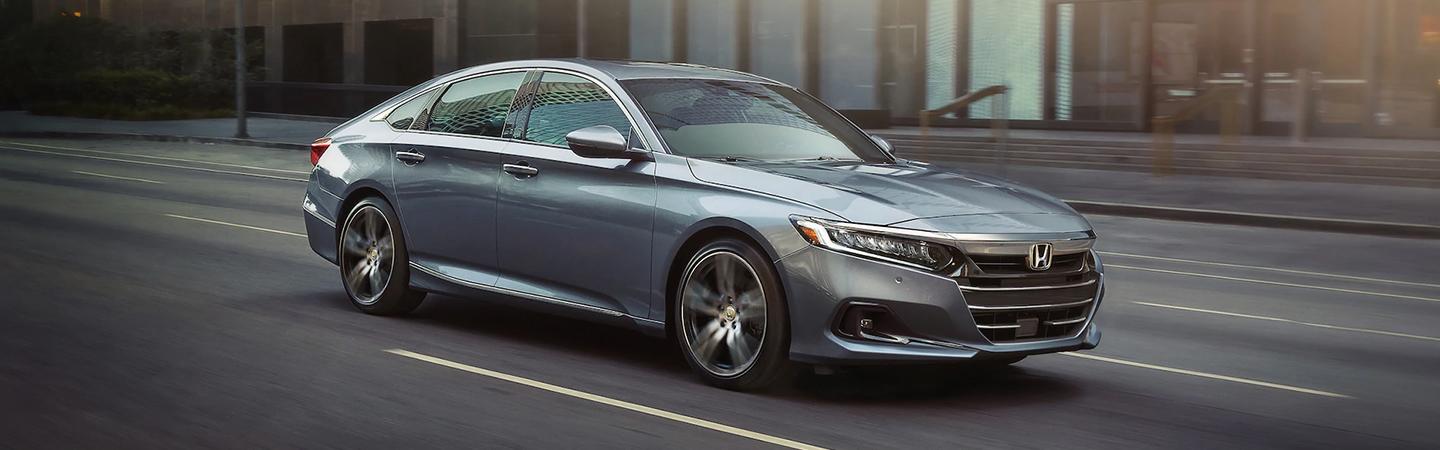 2021 Honda Accord passenger side view in motion driving in city