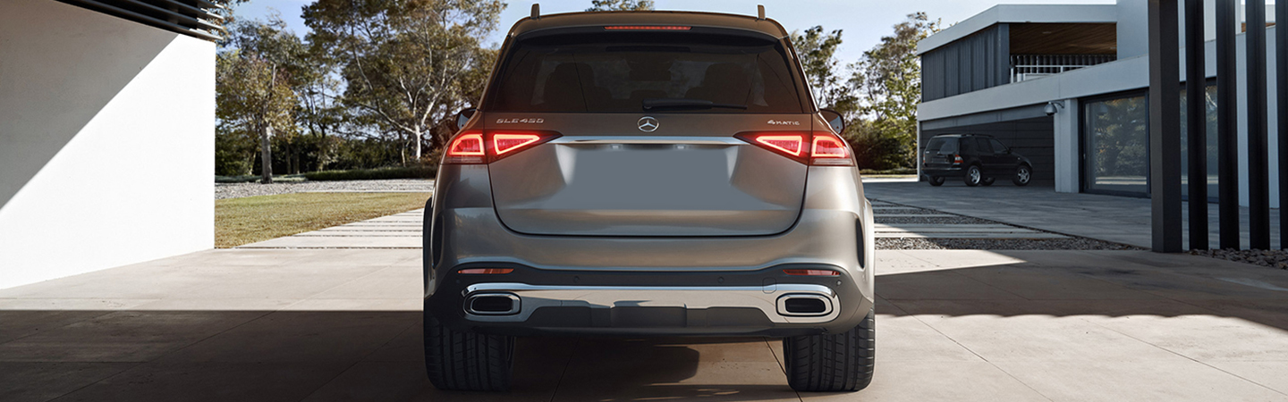 Back view of a parked 2022 Mercedes-Benz GLE-Class at a house