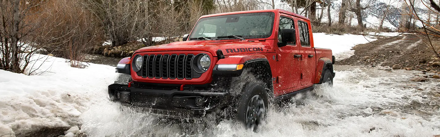 2024 Jeep Gladiator vs Toyota Tacoma front side in white