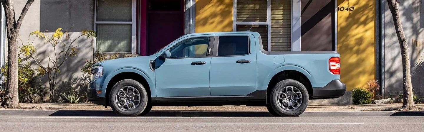 Light blue 2022 Ford Maverick parked on city street