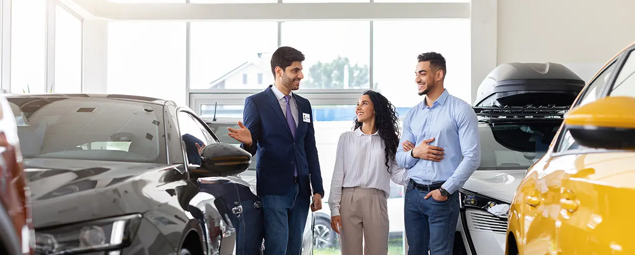 people car shopping in showroom