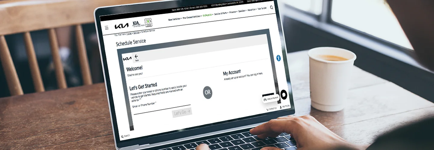 Person looking at the Kia of Orange Park website