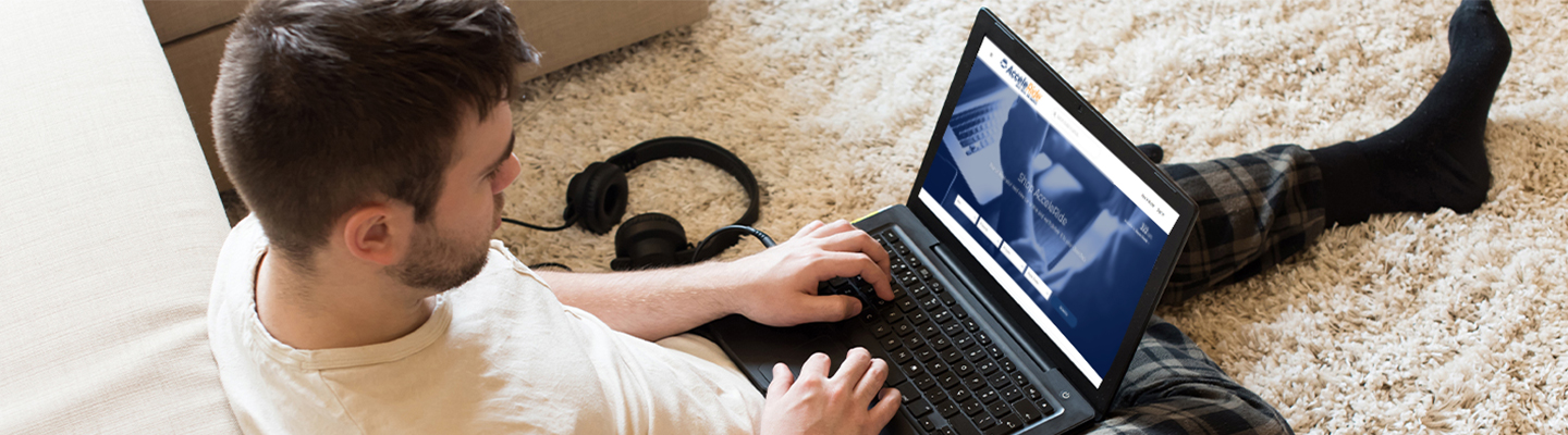 guy in pajamas working on laptop