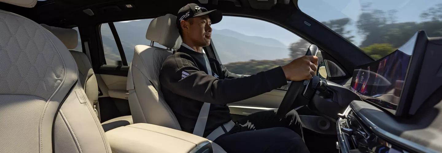 Interior view of a man driving a 2026 BMW X7