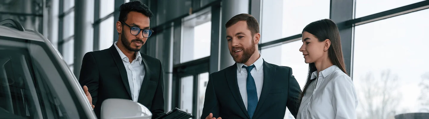 Sales Person Showing Couple A New MINI