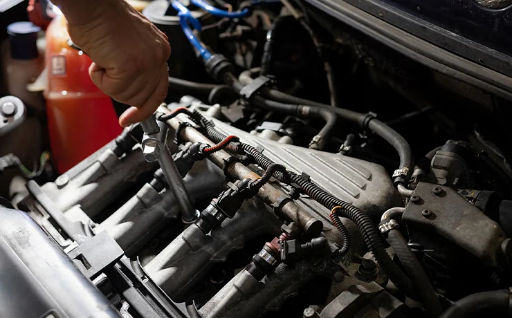 tech looking over engine